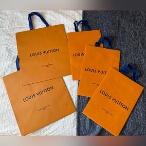 Five Louis Vuitton Shopping Bags